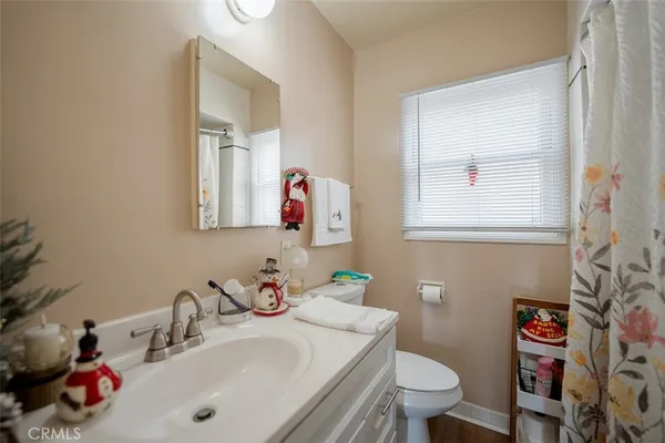 a bathroom with a sink vanity and tub