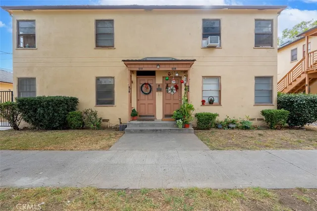 an aerial view of a house with a yard and a garden