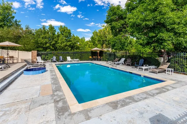 a view of a swimming pool with lounge chair