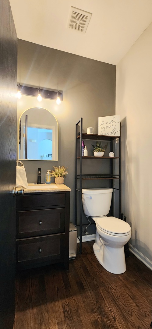 9461 Welsh Lane Huntley, IL 60142 - Photo 11 of 19 a bathroom with a toilet and a mirror