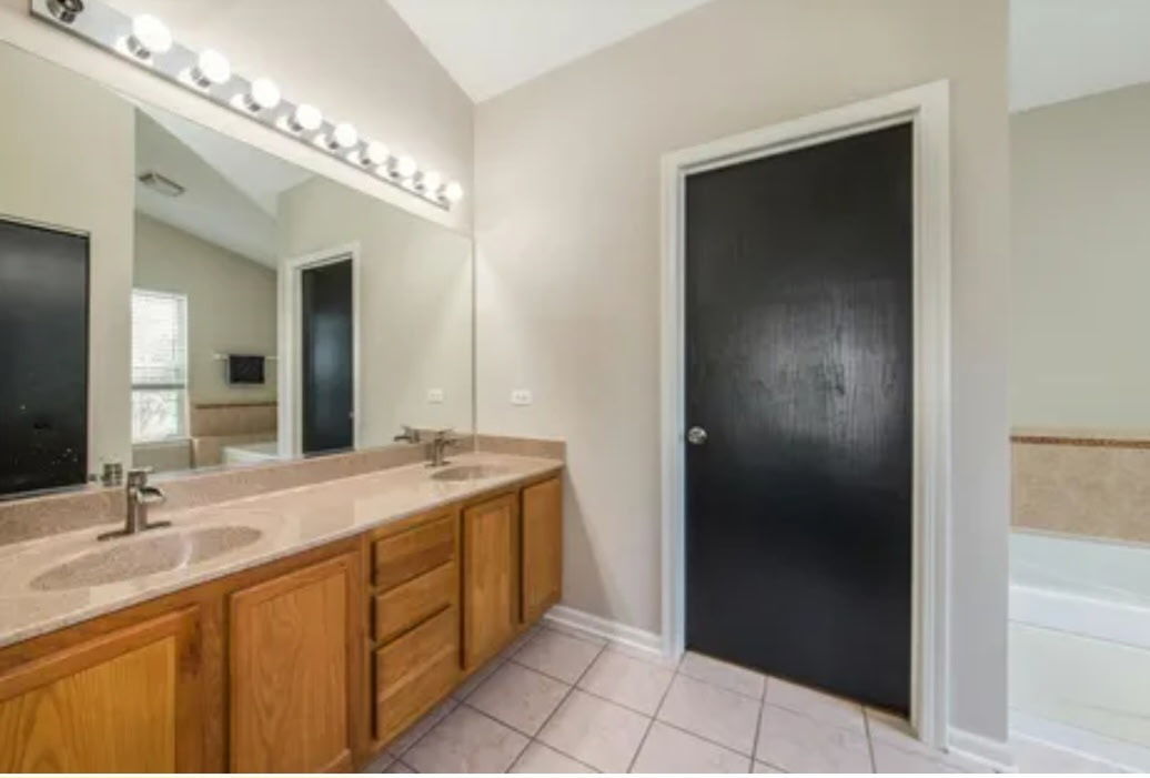 9461 Welsh Lane Huntley, IL 60142 - Photo 14 of 19 a bathroom with a double vanity sink and a mirror