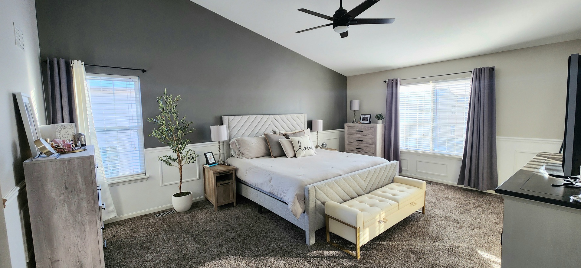 9461 Welsh Lane Huntley, IL 60142 - Photo 17 of 19 a bedroom with a bed and a flat tv screen on dresser