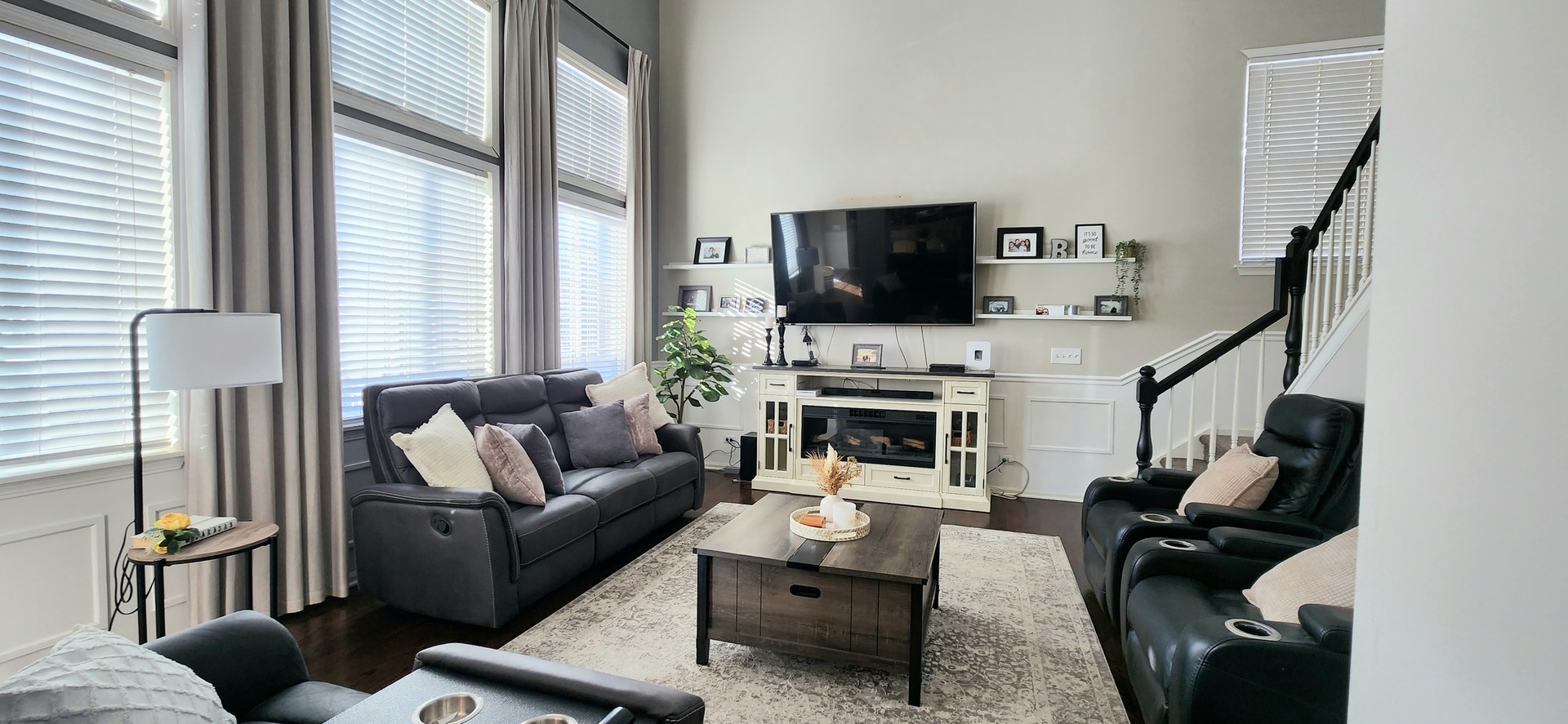 9461 Welsh Lane Huntley, IL 60142 - Photo 4 of 19 a living room with furniture a flat screen tv and a fireplace
