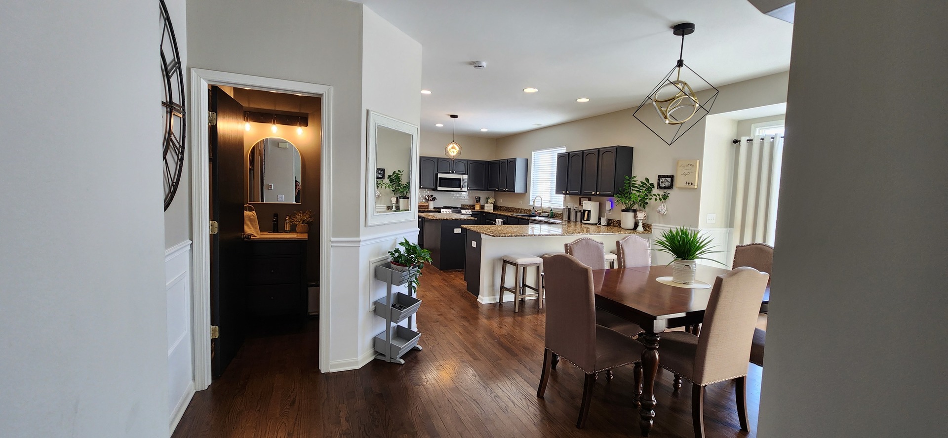 9461 Welsh Lane Huntley, IL 60142 - Photo 10 of 19 a view of a dining room with furniture and wooden floor