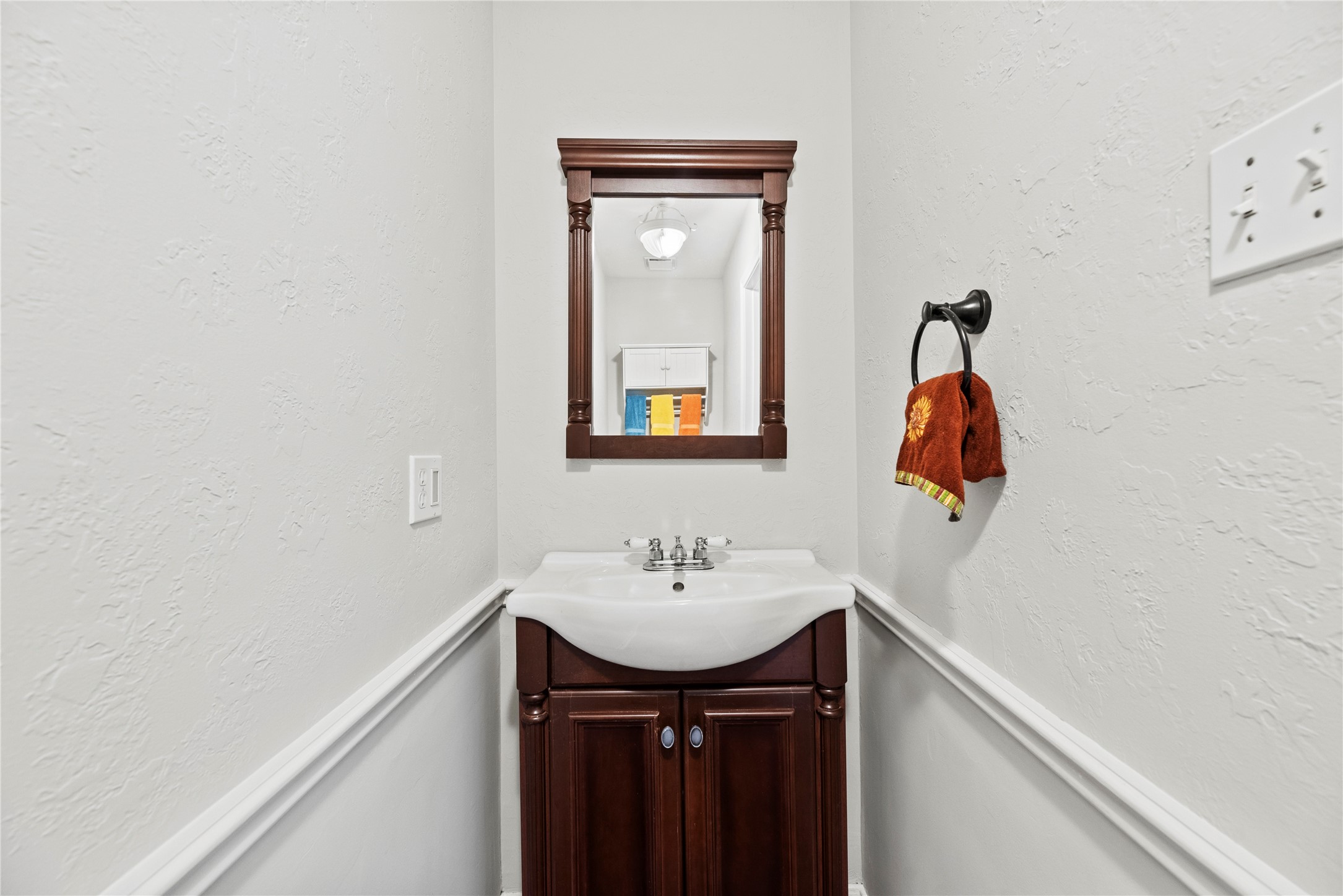7403 Foxton Pl Court Houston, TX 77095 - Photo 17 of 41 The first-floor powder bath is convenient for guests and daily use with a handsome furniture style vanity and coordinating mirror above.