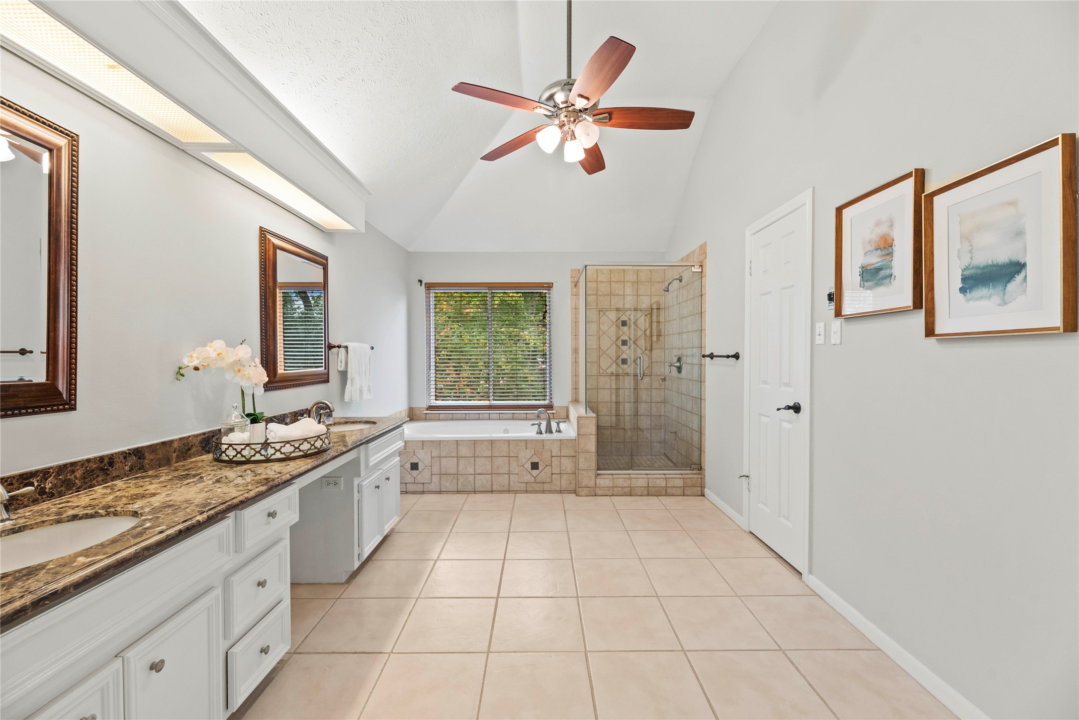 7403 Foxton Pl Court Houston, TX 77095 - Photo 22 of 41 Unwind in the deep soaking tub or refresh in the separate walk-in shower, where neutral tile finishes and soft natural light combine to create a serene, spa like atmosphere.