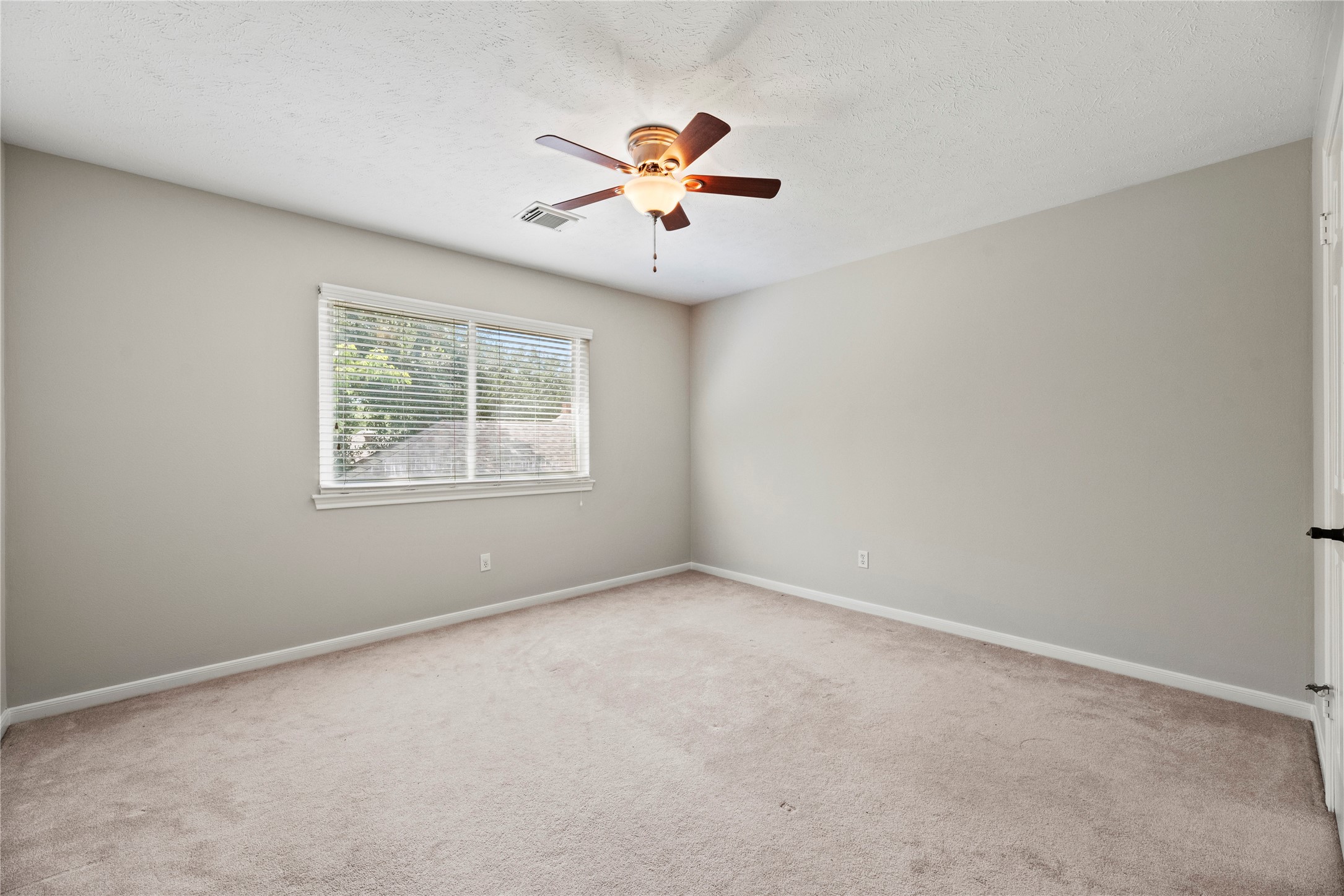 7403 Foxton Pl Court Houston, TX 77095 - Photo 25 of 41 This spacious guest room features soft neutral finishes and plenty of room to stretch out and relax. A large walk-in closet and convenient access to a full bathroom ensure comfort for both family and overnight guests.
