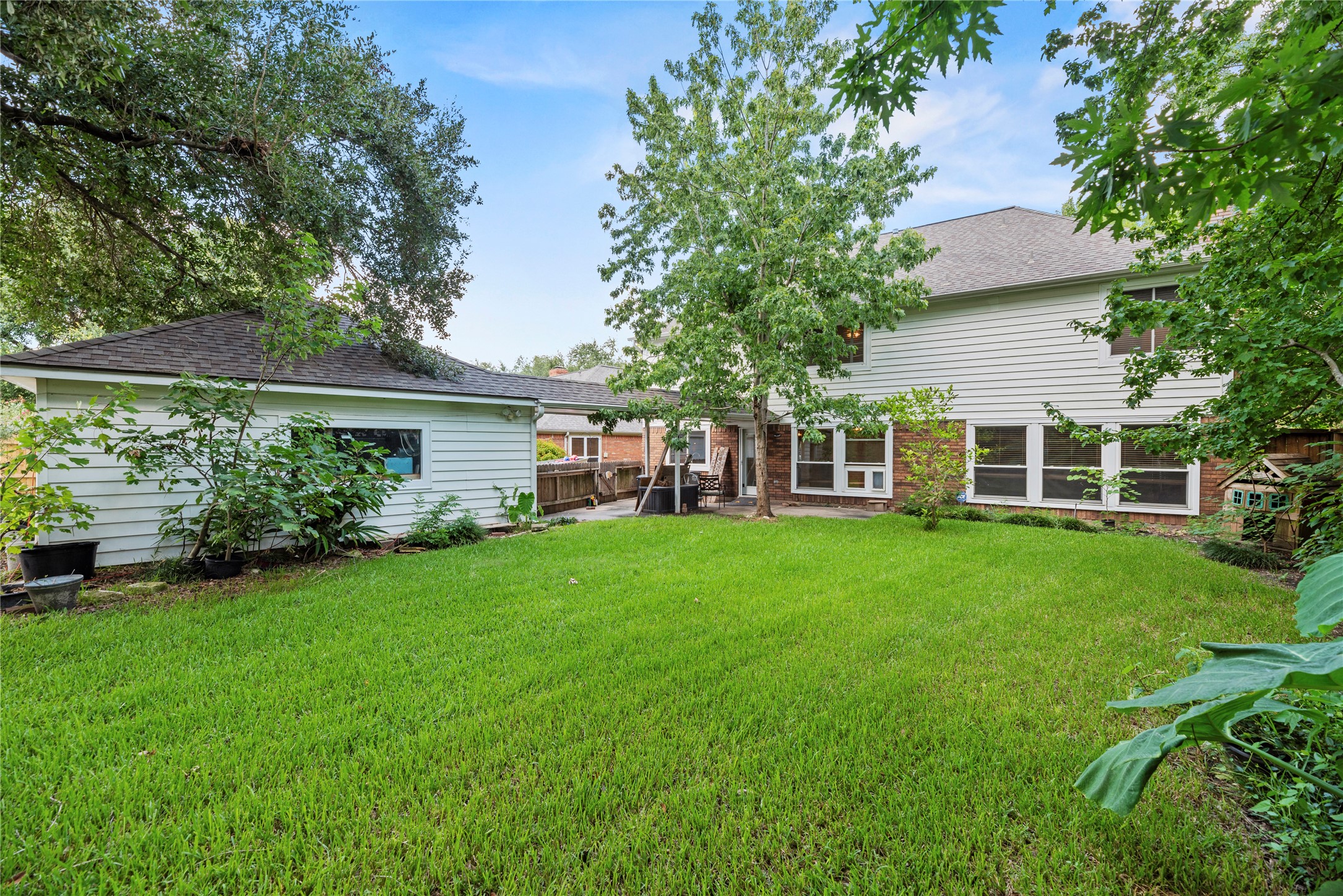 7403 Foxton Pl Court Houston, TX 77095 - Photo 29 of 41 Enjoy quiet mornings with coffee or lively evenings with friends and family in this spacious backyard, where a roomy patio provides the perfect setting for outdoor dining, entertaining, and relaxing.