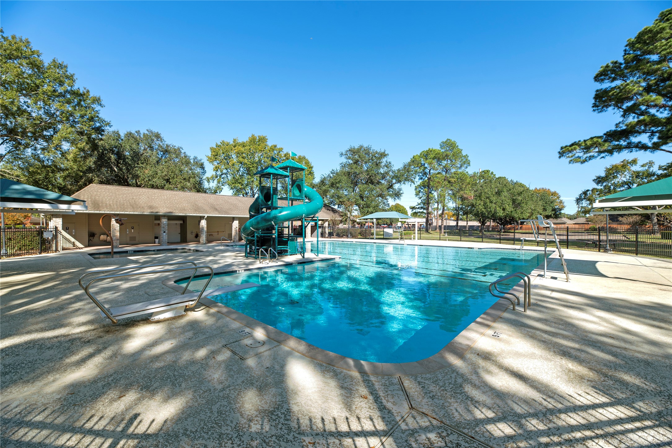 7403 Foxton Pl Court Houston, TX 77095 - Photo 34 of 41 This sparkling neighborhood
pool offers dedicated lap lanes, a
deep end with a diving board,
fun slides, and plenty of poolside
deck space to relax and enjoy
the day.
