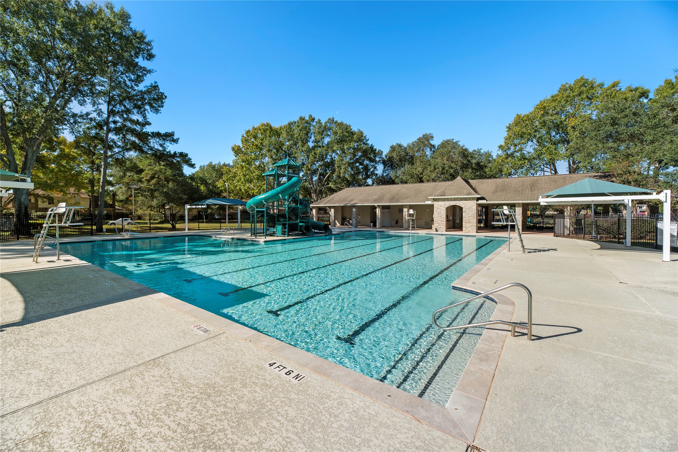 7403 Foxton Pl Court Houston, TX 77095 - Photo 35 of 41 Cool off on warm Texas days at
the neighborhood pool, a favorite
gathering spot to swim, play,
relax, and enjoy sunshine and
fresh air. The pool features fun
slides, a diving board and deep
end, lined lanes for lap
swimmers, and an expansive
shaded deck perfect for poolside
lounging.