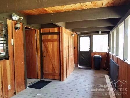 56083 Snow Goose Road Bend, OR 97707 - Photo 9 of 24 Screened porch in back of house with sto