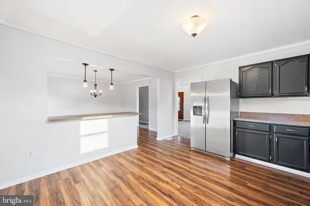 a view of a hallway with a white door