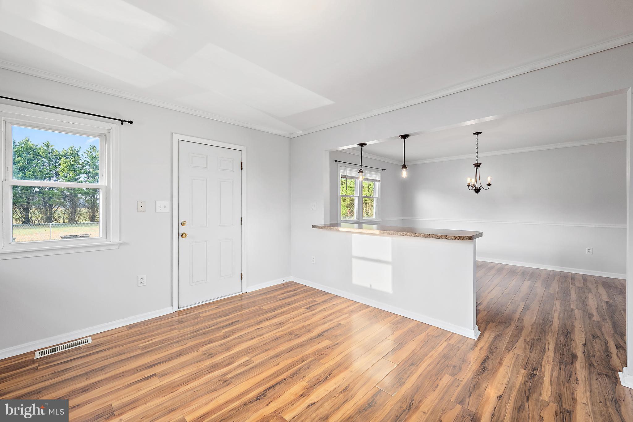 26792 Porter Mill Road Hebron, MD 21830 - Photo 14 of 91 a view of a kitchen with wooden floor and a sink