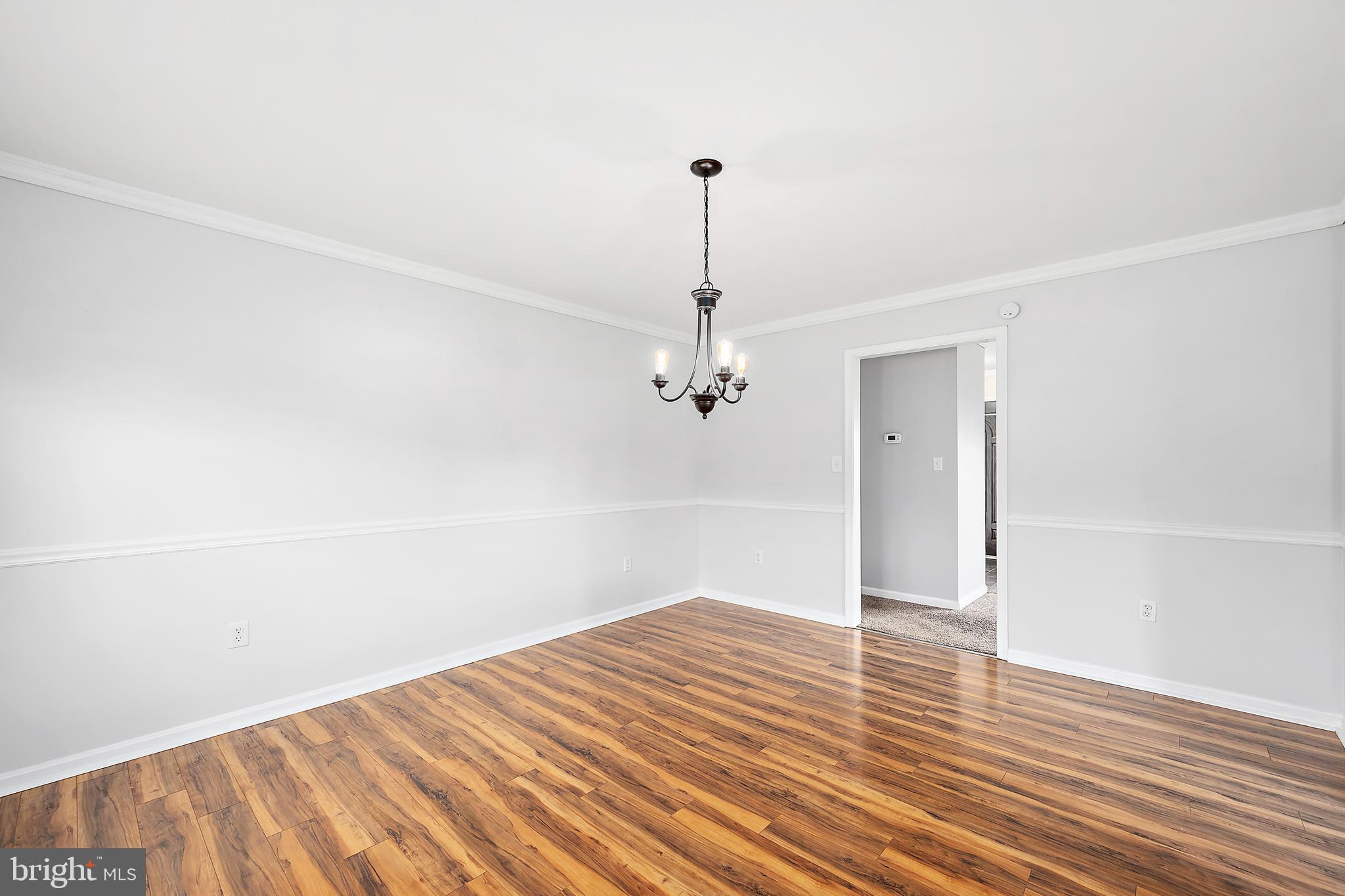 26792 Porter Mill Road Hebron, MD 21830 - Photo 18 of 91 a view of a room with wooden floor and white walls
