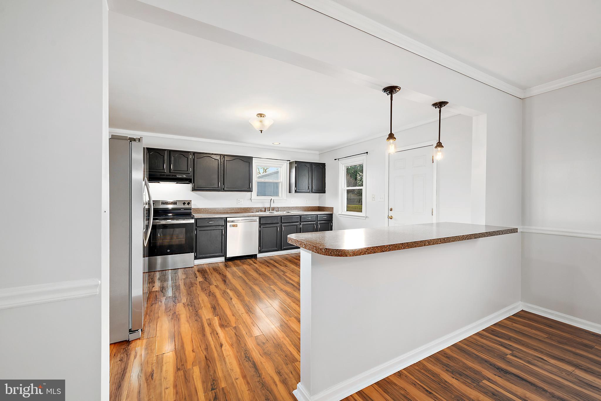 26792 Porter Mill Road Hebron, MD 21830 - Photo 20 of 91 a kitchen with a sink a counter top space stainless steel appliances and cabinets