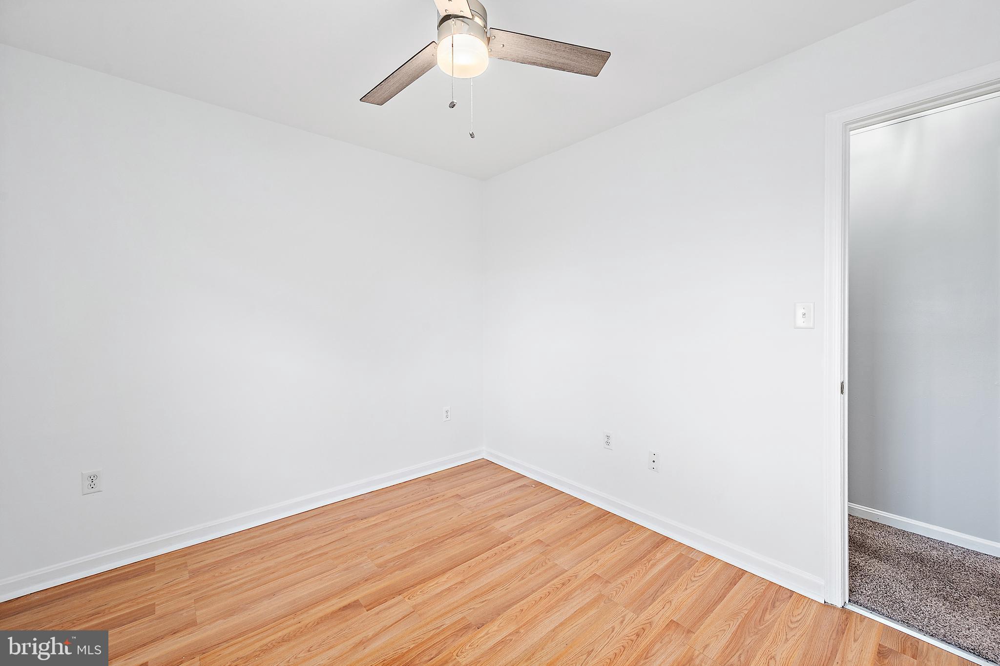 26792 Porter Mill Road Hebron, MD 21830 - Photo 24 of 91 an empty room with wooden floor and fan