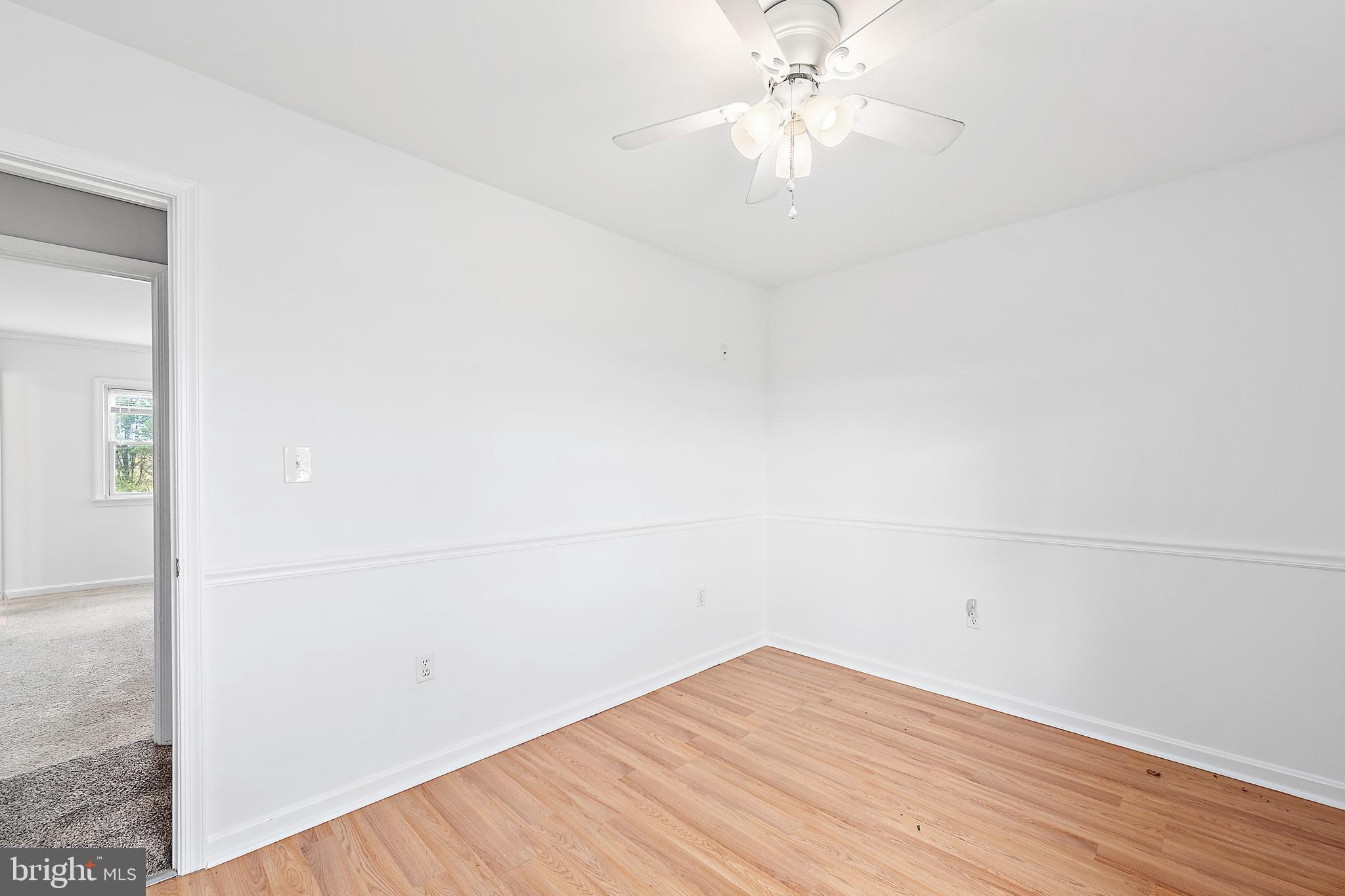 26792 Porter Mill Road Hebron, MD 21830 - Photo 33 of 91 an empty room with wooden floor and fan