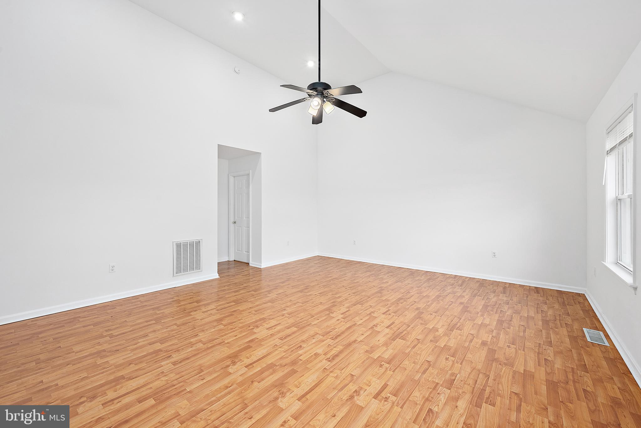 26792 Porter Mill Road Hebron, MD 21830 - Photo 44 of 91 a view of empty room with wooden floor and fan