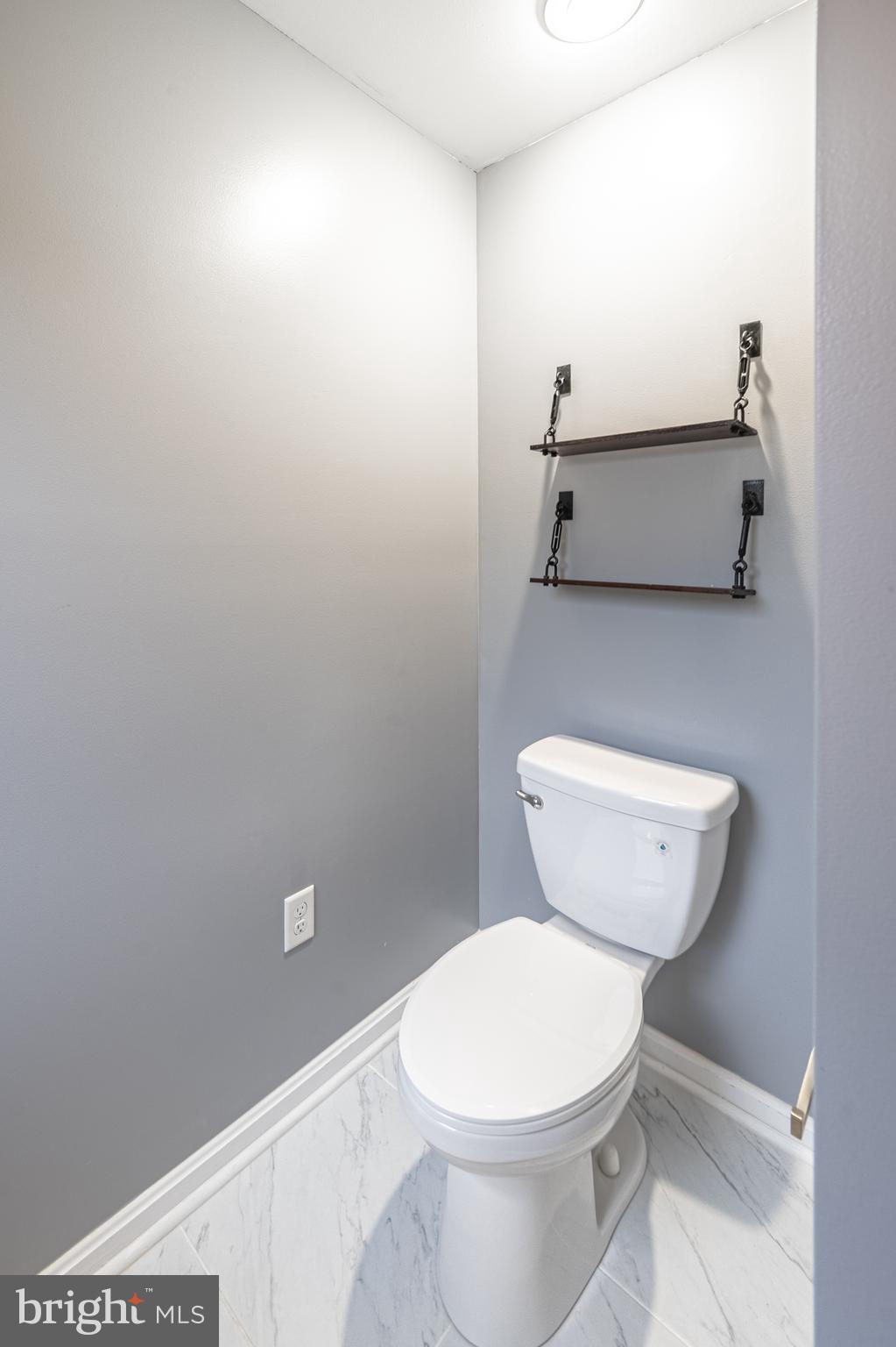 26792 Porter Mill Road Hebron, MD 21830 - Photo 53 of 91 a bathroom with a toilet and a sink
