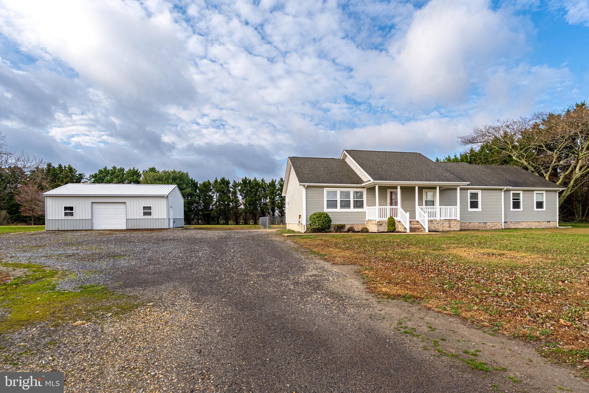 26792 Porter Mill Road Hebron, MD 21830 - Photo 69 of 91 a front view of a house with a garden and yard