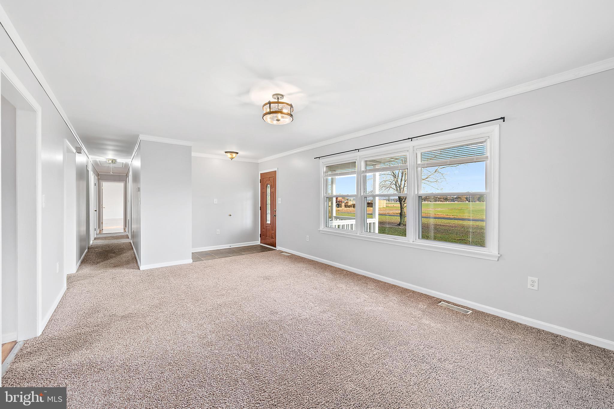 26792 Porter Mill Road Hebron, MD 21830 - Photo 9 of 91 a view of an empty room with a window