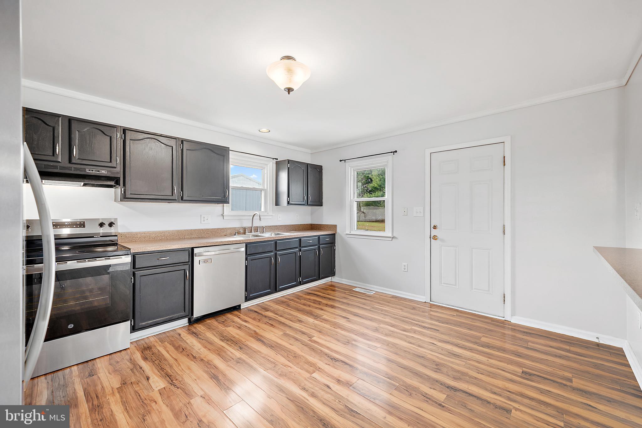 26792 Porter Mill Road Hebron, MD 21830 - Photo 10 of 91 a kitchen with stainless steel appliances granite countertop a refrigerator and a stove top oven