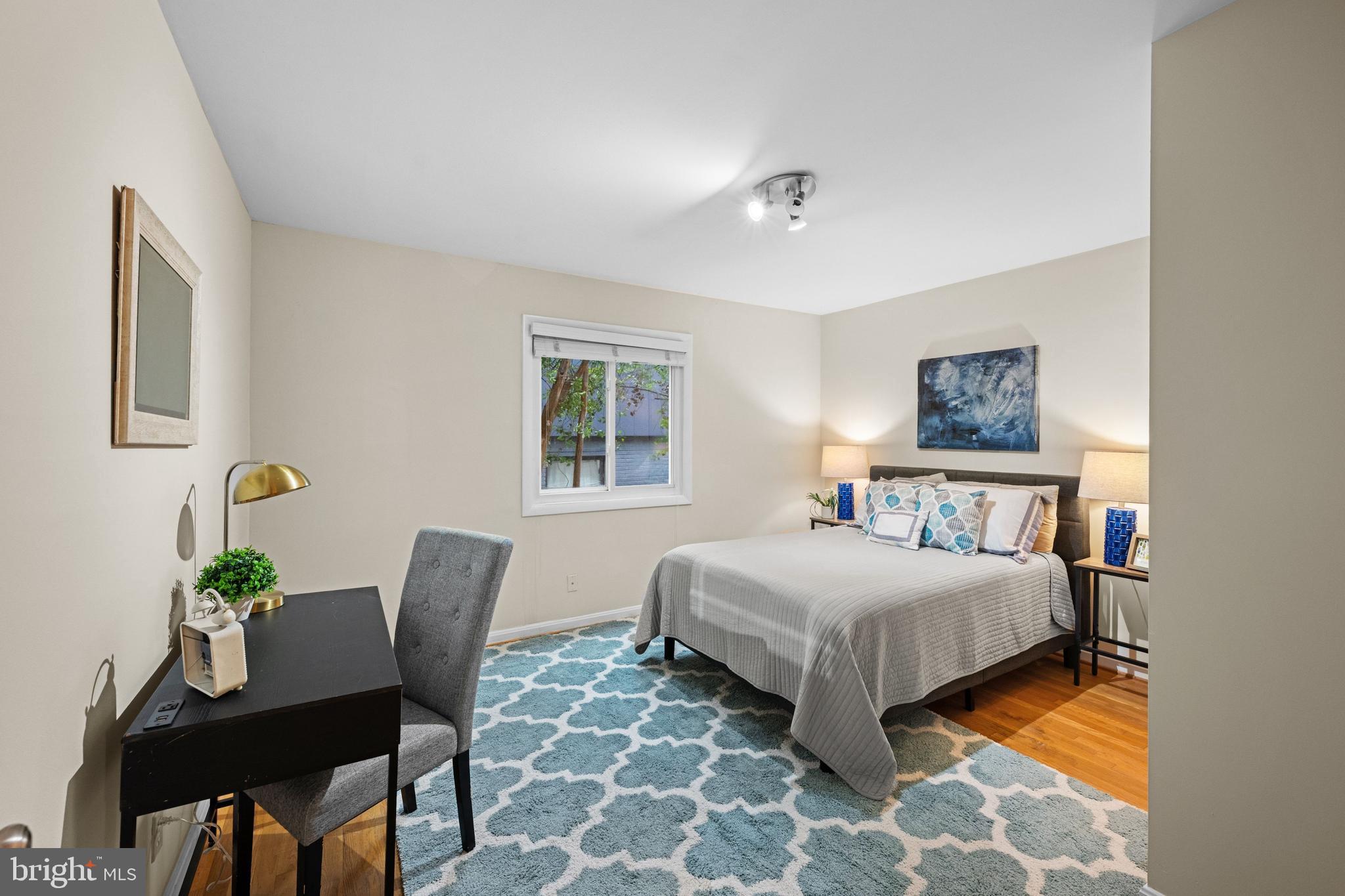 3529 Yuma Street Northwest Washington, DC 20008 - Photo 21 of 46 a bedroom with a bed and a table in it