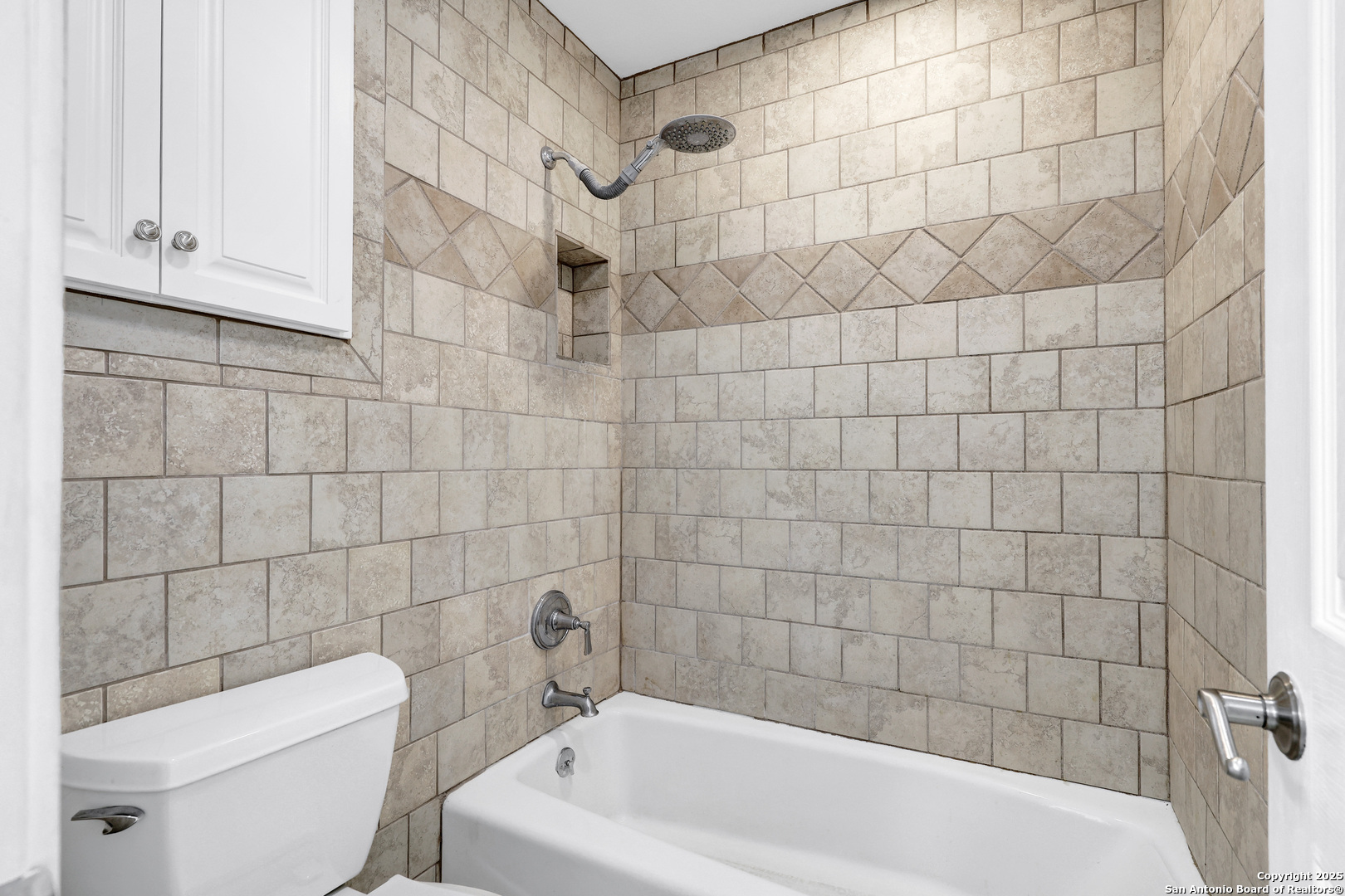 7103 Spring Point Street San Antonio, TX 78249 - Photo 22 of 28 a bathroom with a bathtub and toilet