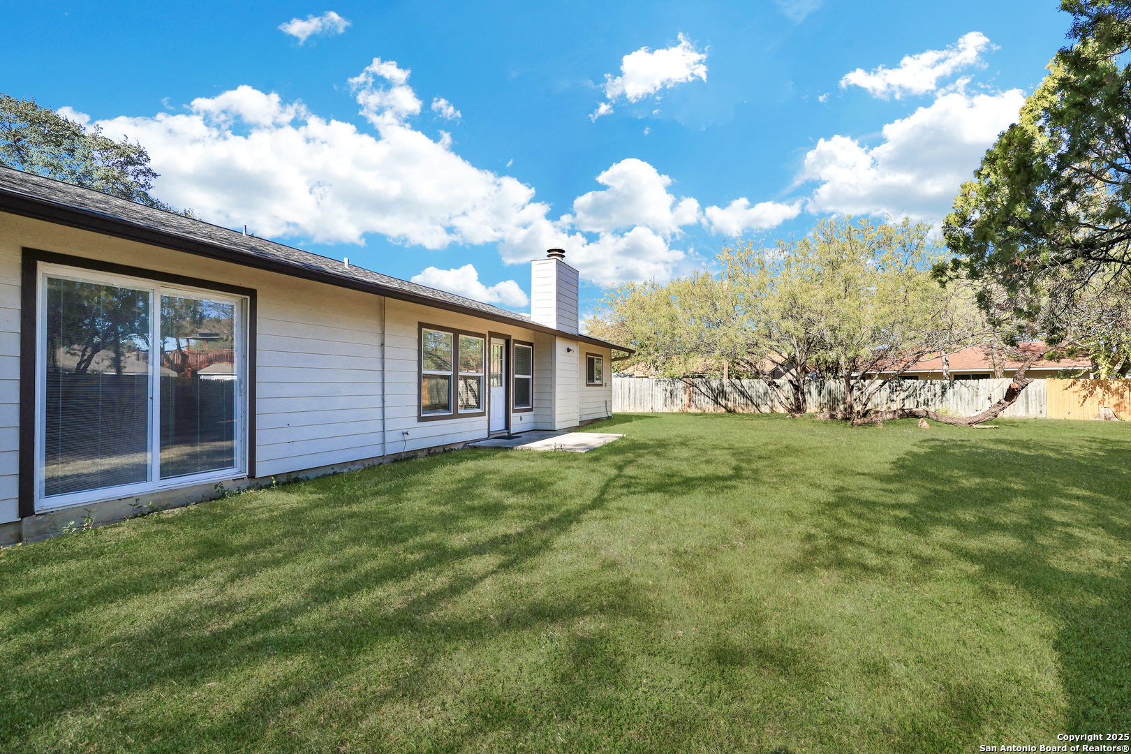 7103 Spring Point Street San Antonio, TX 78249 - Photo 26 of 28 a view of a house with backyard
