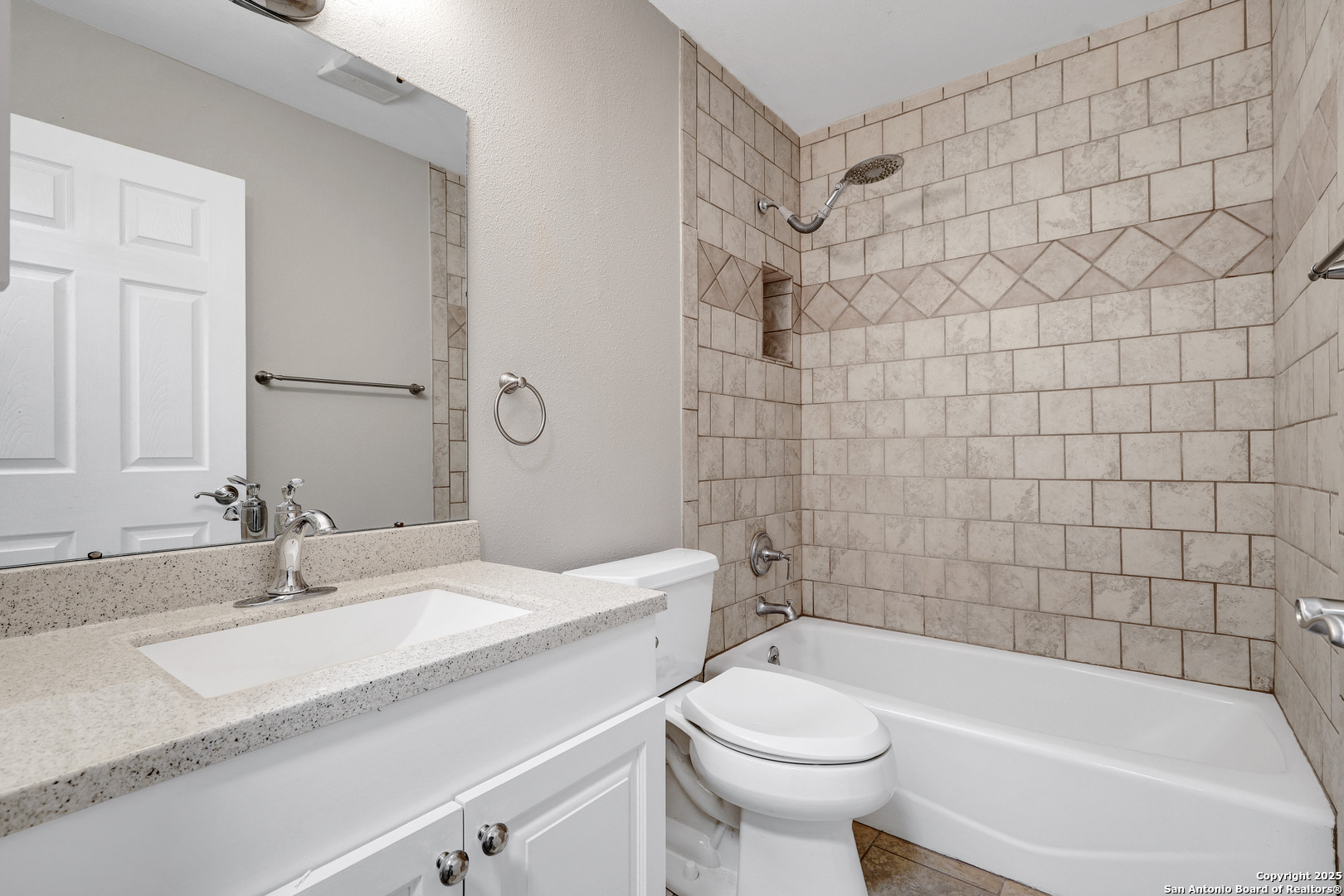 7103 Spring Point Street San Antonio, TX 78249 - Photo 10 of 28 a bathroom with a sink a toilet and shower