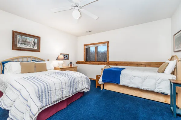 a large kitchen with stainless steel appliances granite countertop a lot of counter space and wooden floors