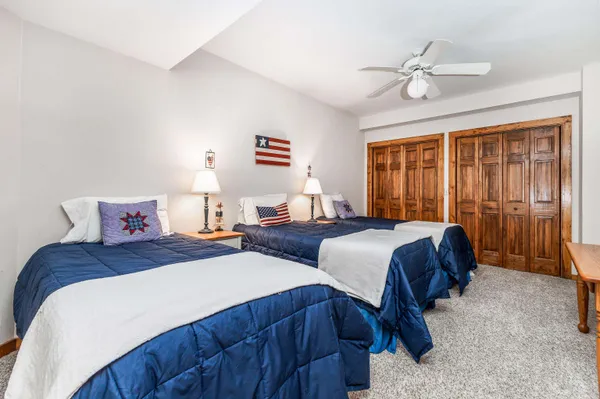 a view of balcony with wooden floor and fence