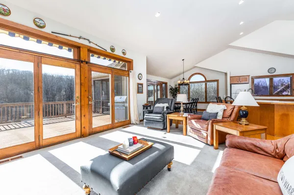 a spacious bedroom with a bed and a large window