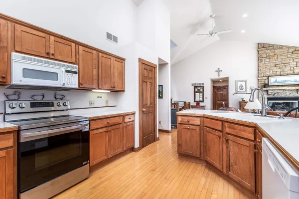 a view of a dining room with furniture large windows and wooden floor