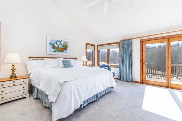 a bedroom with a bed and a couch