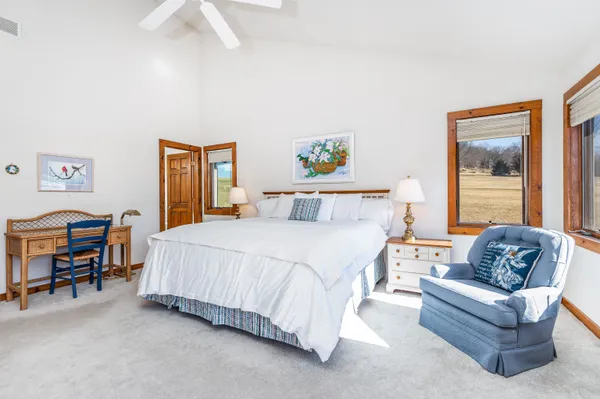a spacious bathroom with a double vanity sink mirror and
