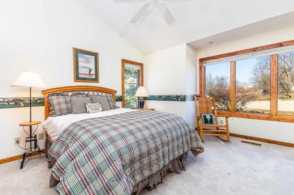 a view of a dining room with furniture wooden floor and chandelier