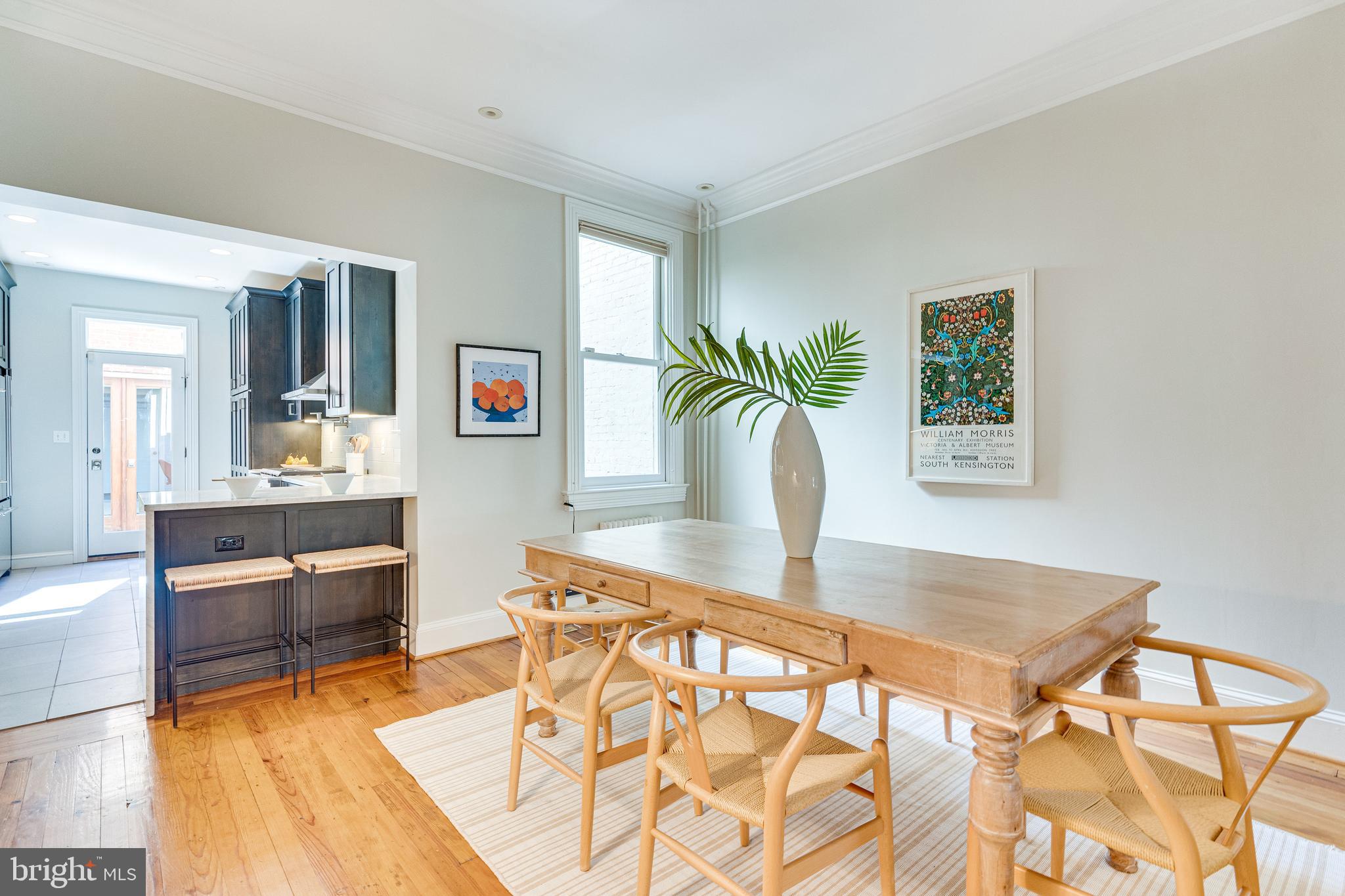 139 12th Street Northeast Washington, DC 20002 - Photo 10 of 50 a view of kitchen with kitchen island dining table and chairs