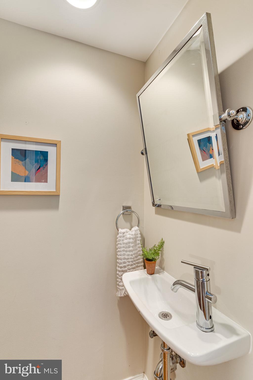139 12th Street Northeast Washington, DC 20002 - Photo 13 of 50 a bathroom with a sink and a mirror