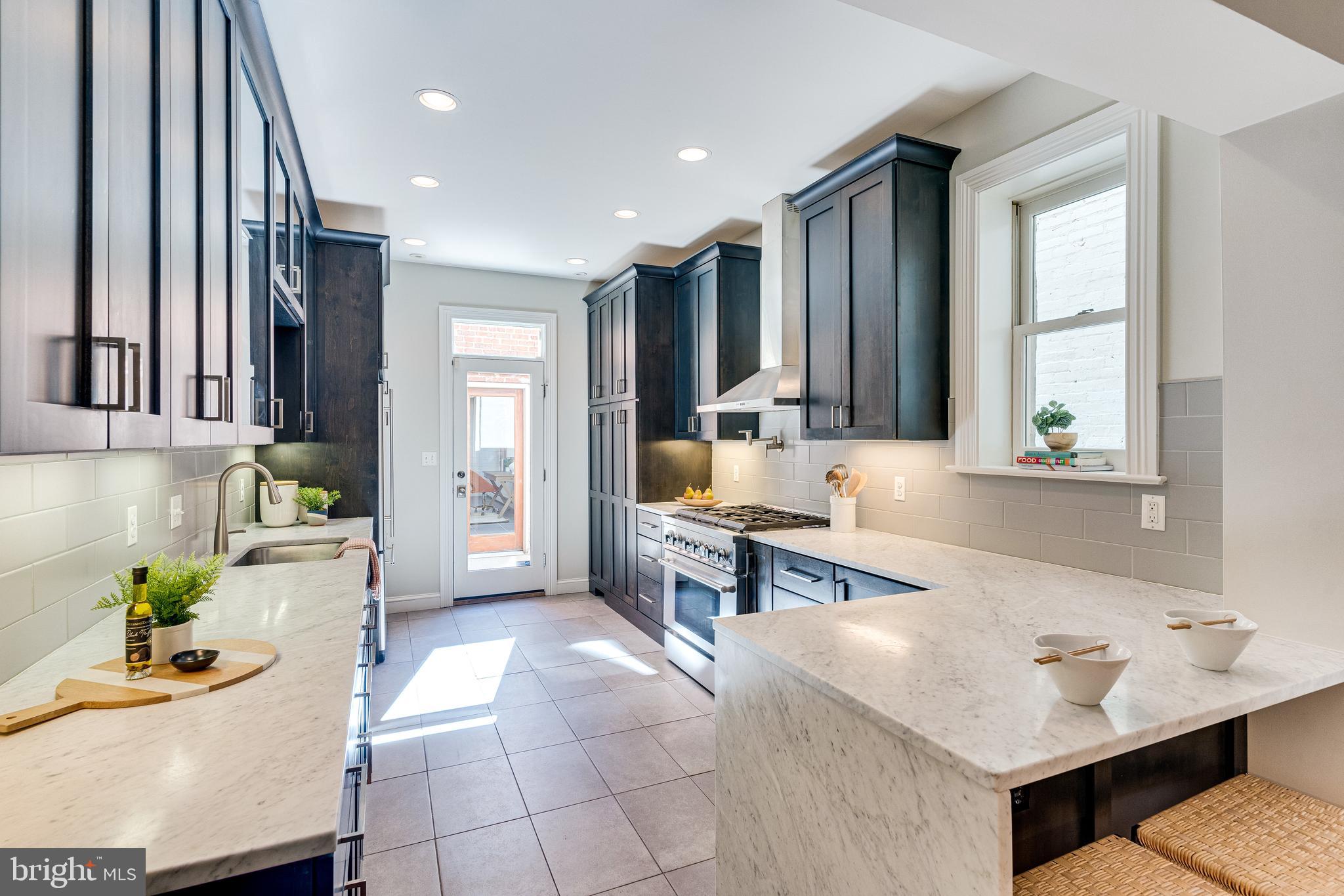 139 12th Street Northeast Washington, DC 20002 - Photo 14 of 50 a spacious bathroom with a tub sink and mirror