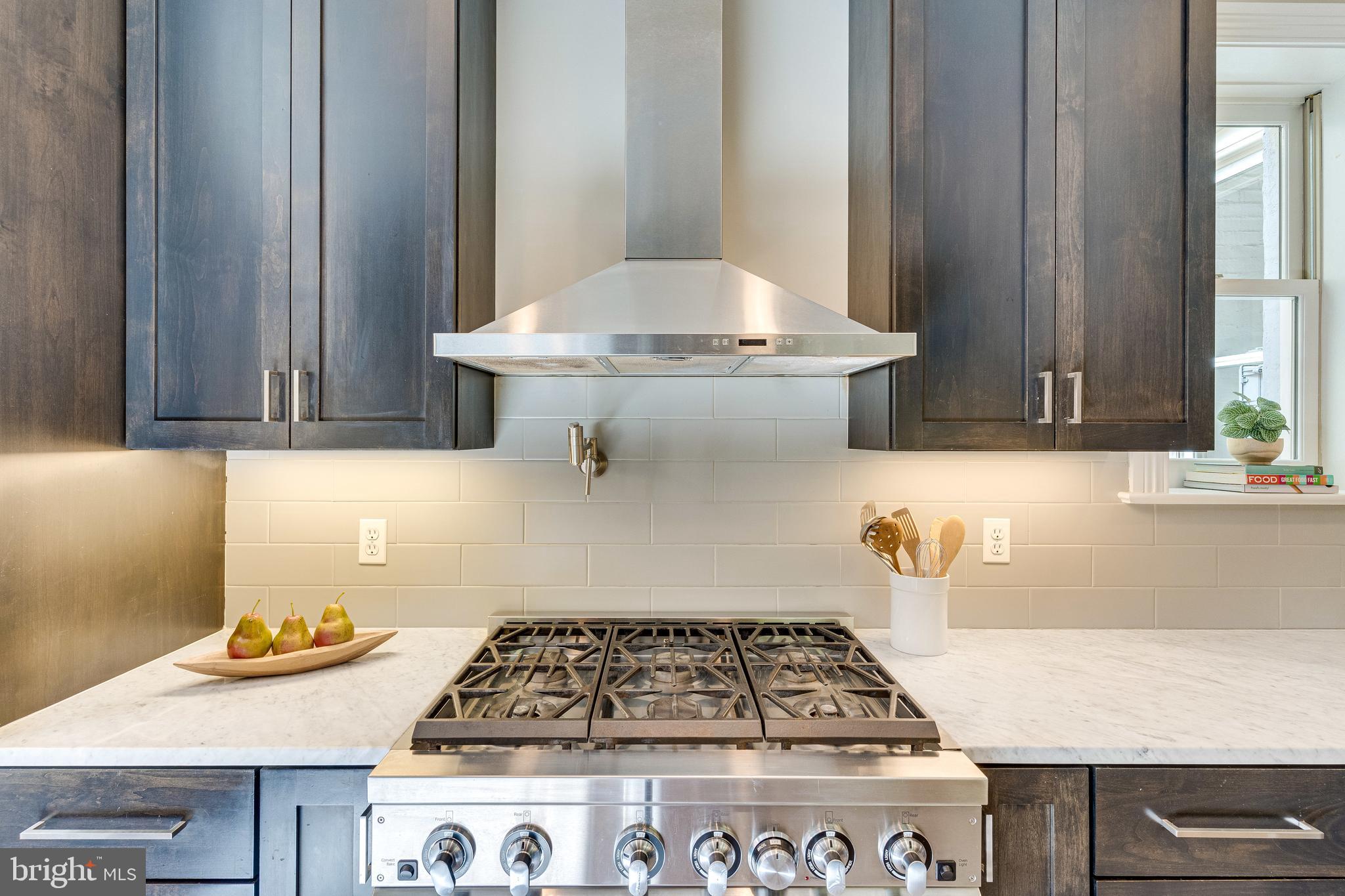 139 12th Street Northeast Washington, DC 20002 - Photo 16 of 50 a kitchen with a stove and a cabinet