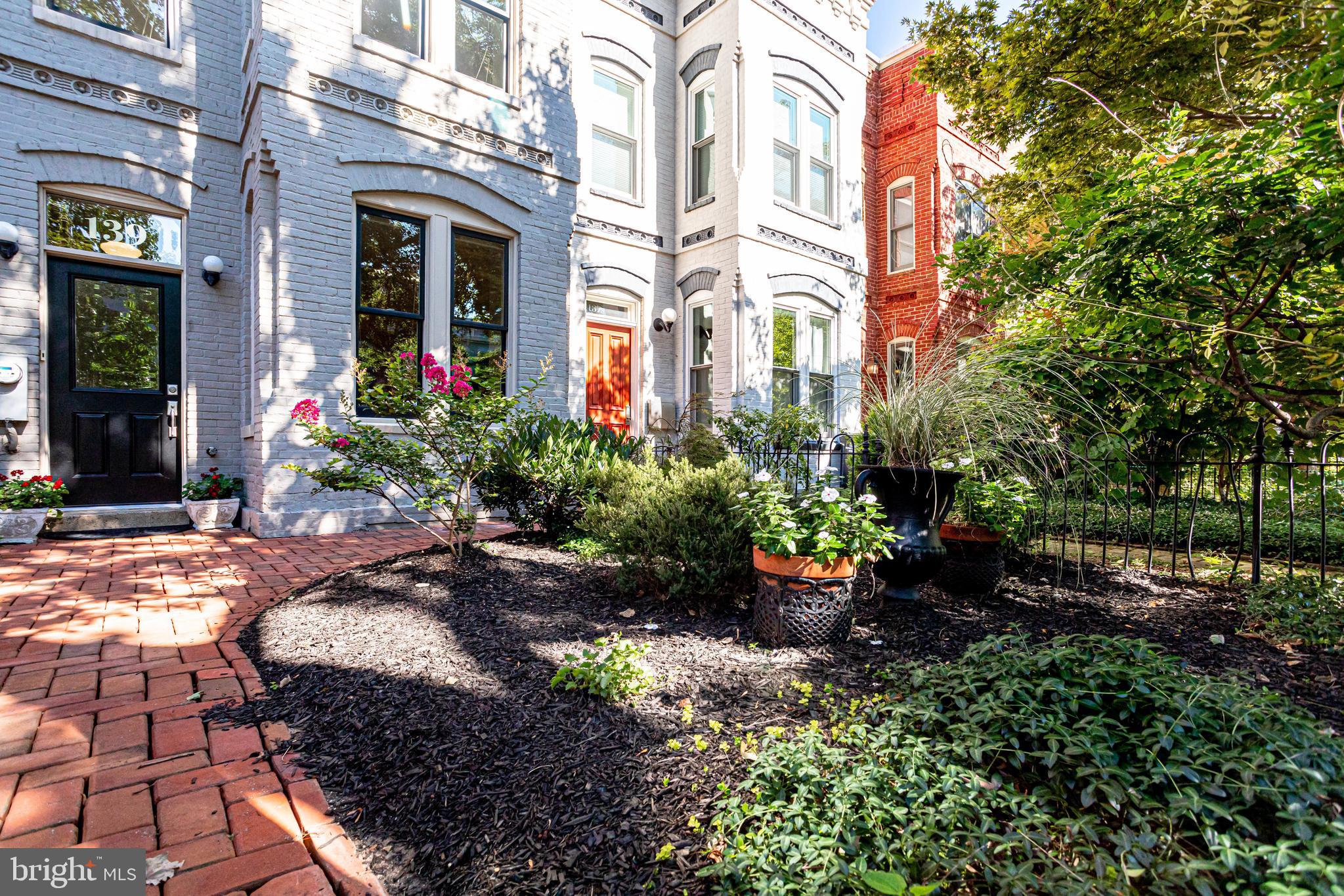 139 12th Street Northeast Washington, DC 20002 - Photo 2 of 50 a view of a house with chairs and flower plants