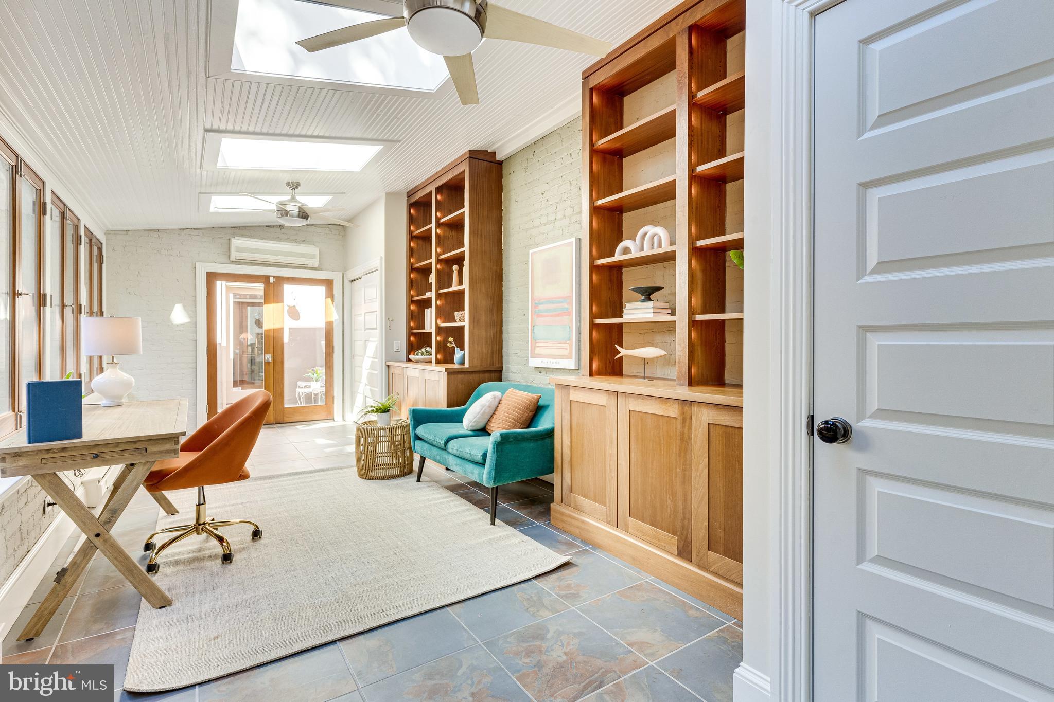 139 12th Street Northeast Washington, DC 20002 - Photo 24 of 50 a living room with furniture and large windows