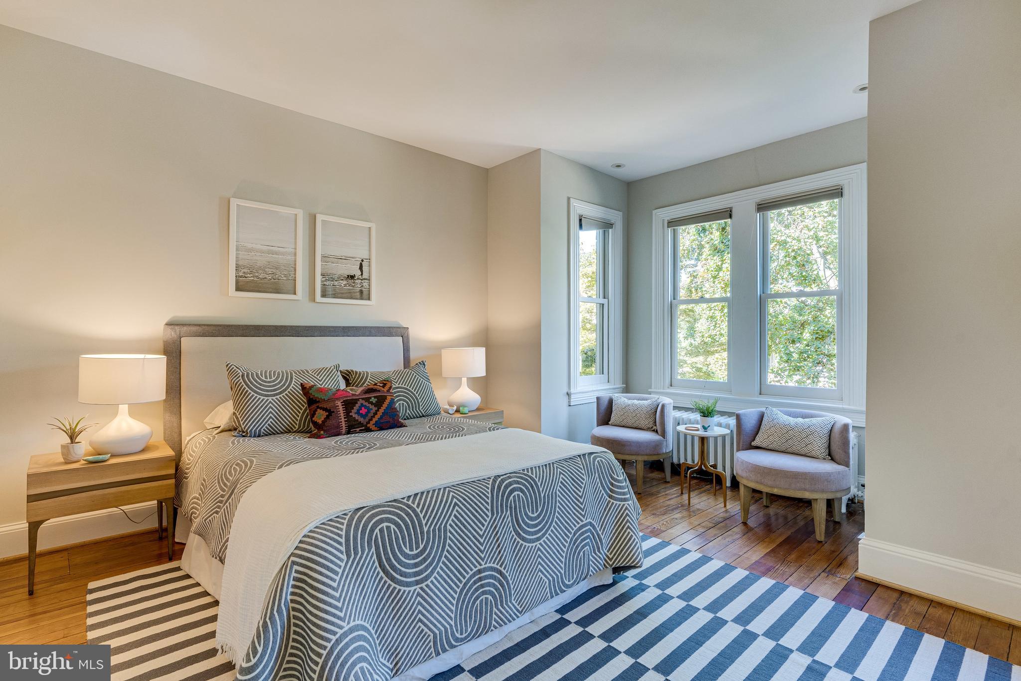 139 12th Street Northeast Washington, DC 20002 - Photo 31 of 50 a bedroom with a bed and wooden floor