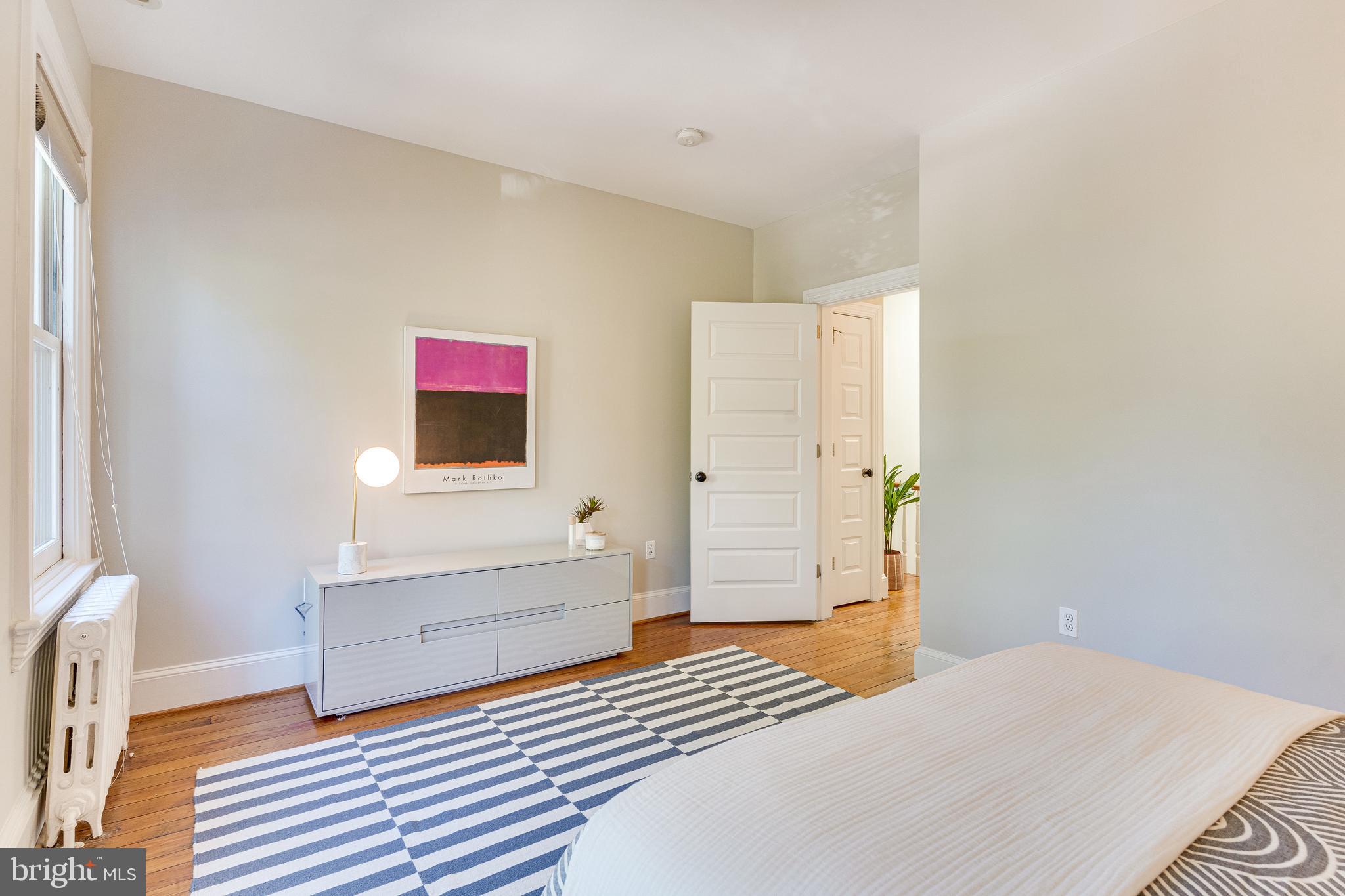 139 12th Street Northeast Washington, DC 20002 - Photo 39 of 50 a bedroom with a bed and a flat screen tv