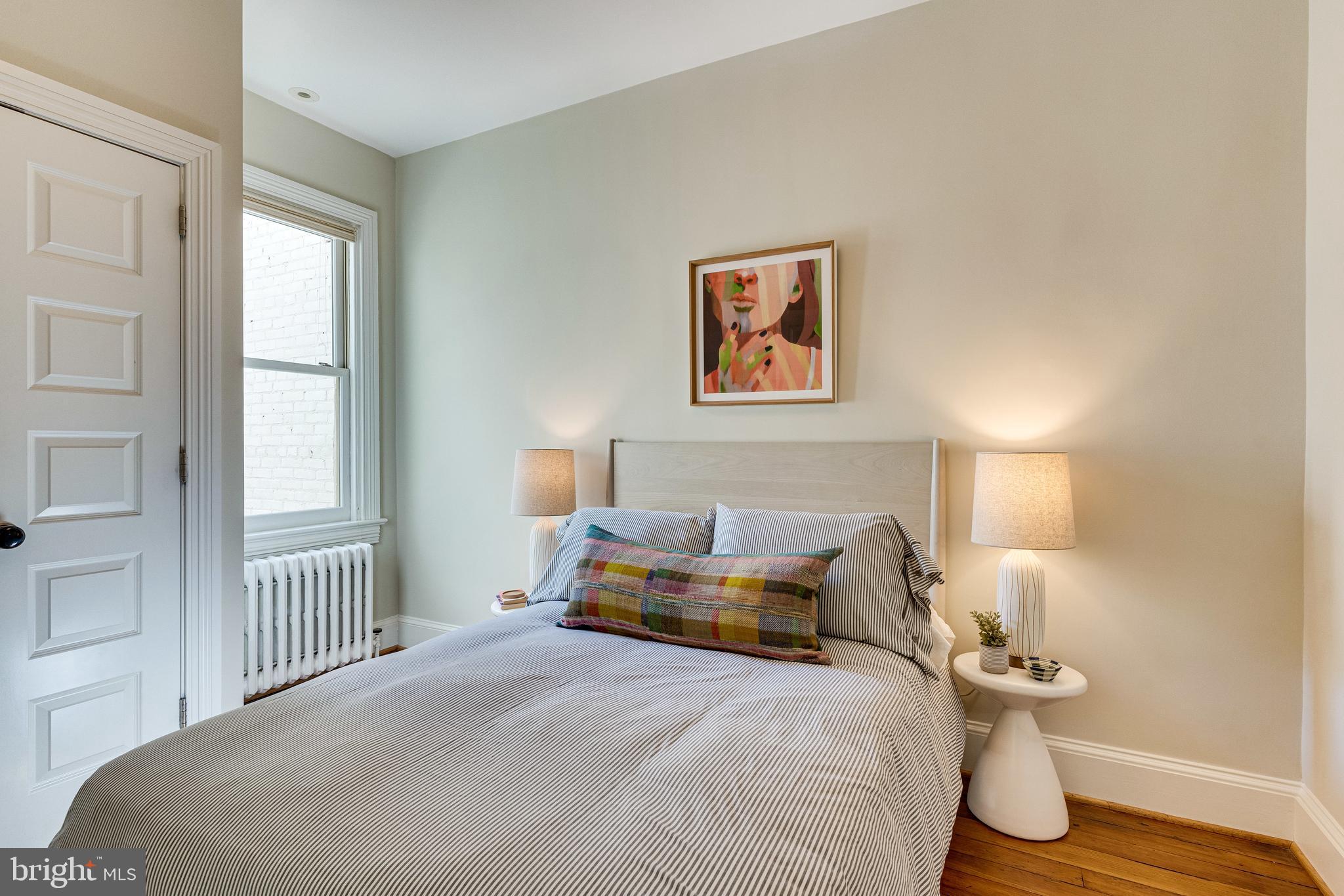 139 12th Street Northeast Washington, DC 20002 - Photo 41 of 50 a bedroom with a bed and wooden floor