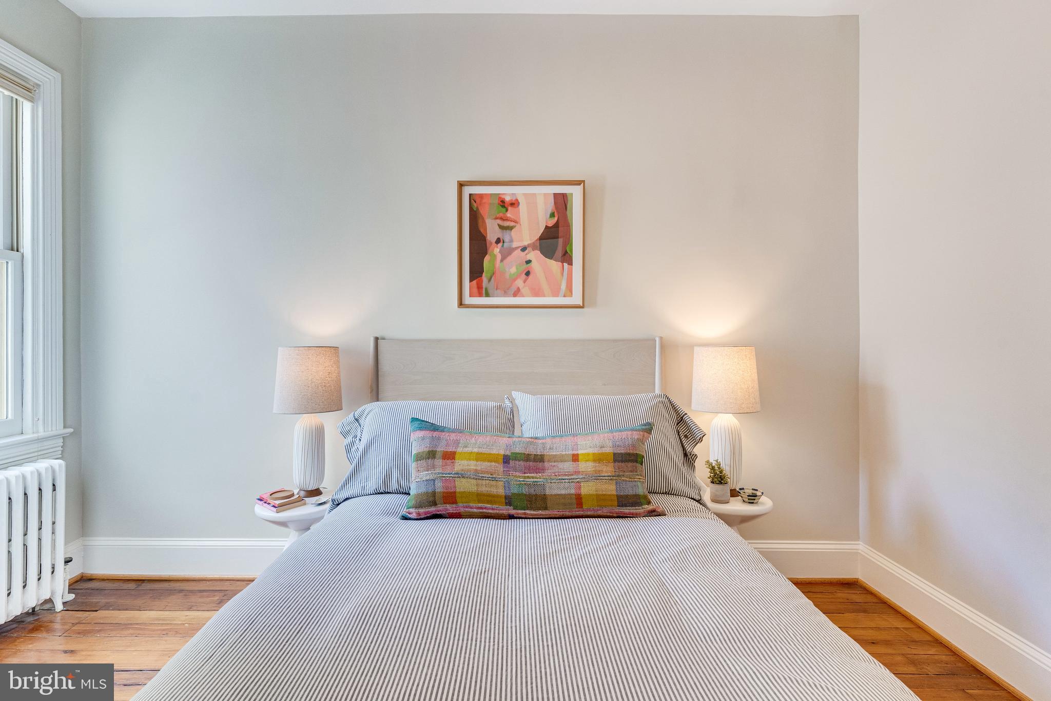 139 12th Street Northeast Washington, DC 20002 - Photo 42 of 50 a spacious bedroom with a bed and a window