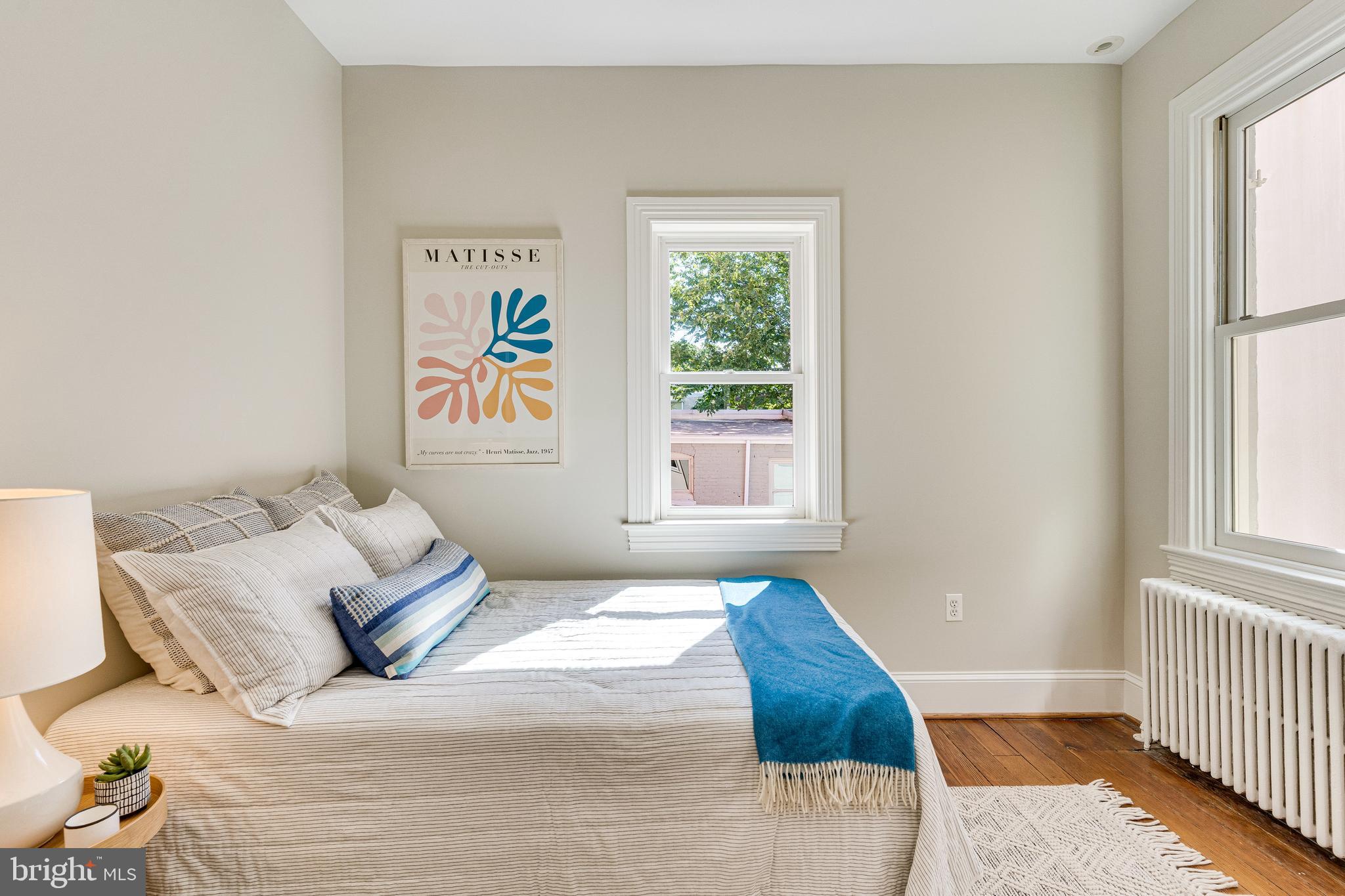 139 12th Street Northeast Washington, DC 20002 - Photo 47 of 50 a bedroom with a bed and a window