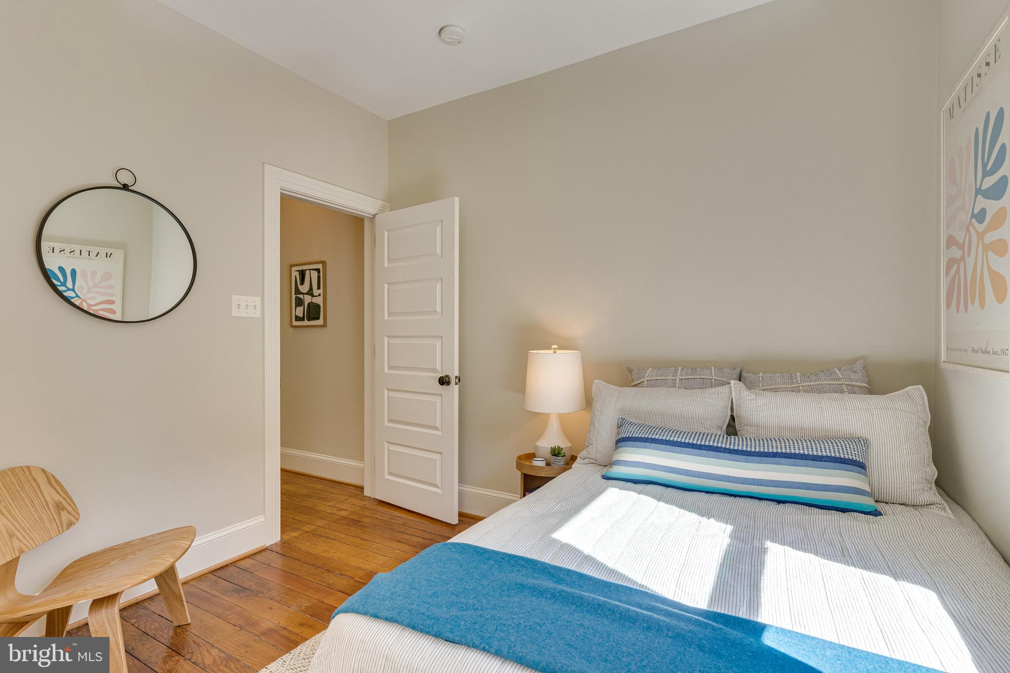 139 12th Street Northeast Washington, DC 20002 - Photo 48 of 50 a bedroom with a bed and chair