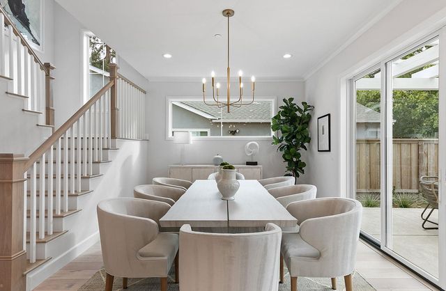 a view of a dining room with furniture window and wooden floor
